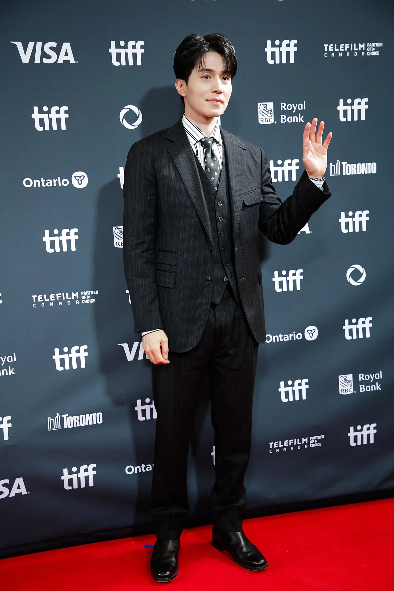 Lee Dong-wook posing for photographers at the Toronto International Film Festival in September 2024
