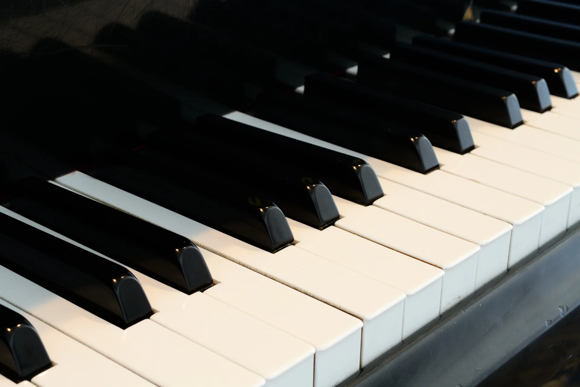 Close-up photograph of black and white piano keys