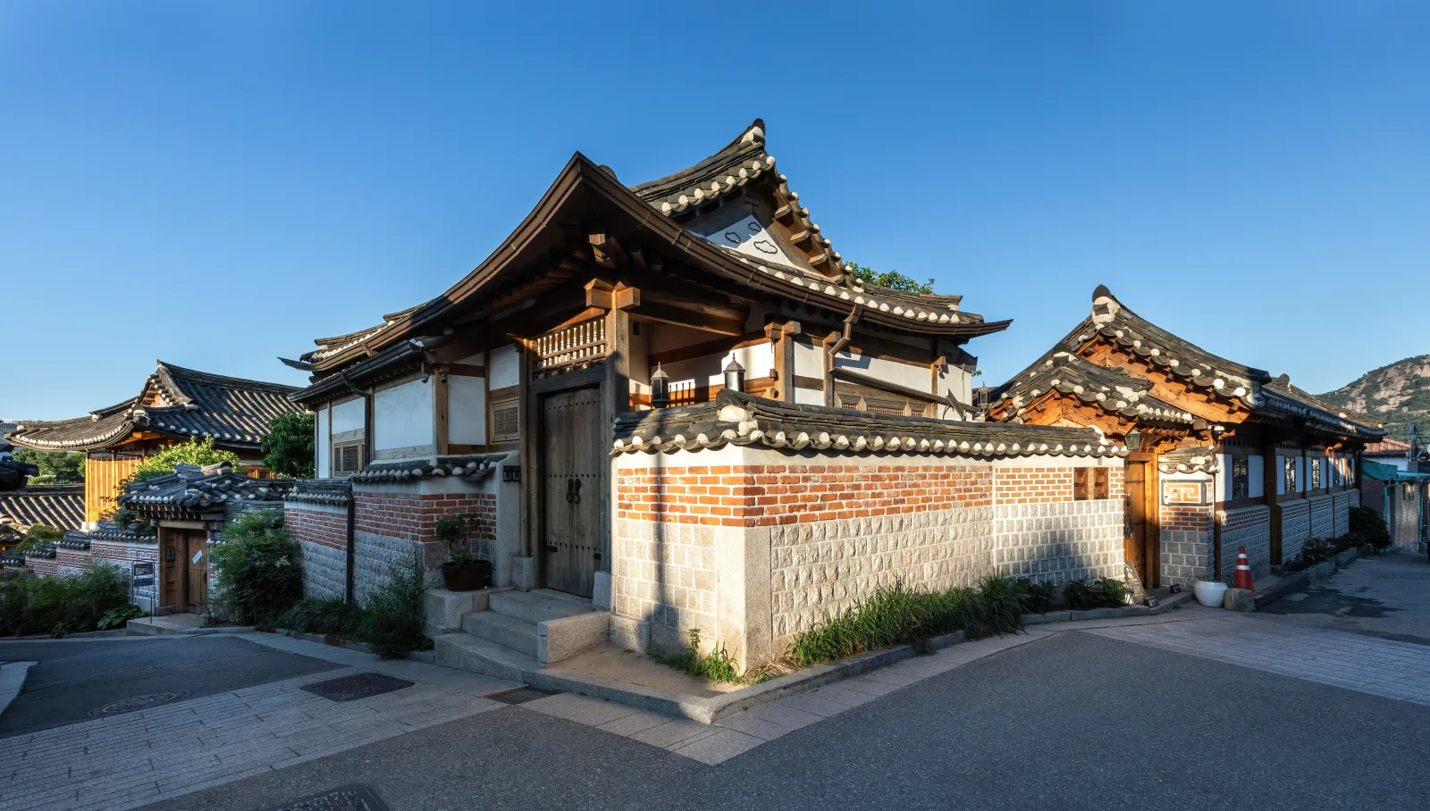Traditional hanok rooftops at golden hour in Bukchon Hanok Village, Seoul